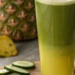 Belly fat burning juice: A tall glass of belly fat burning juice on a rustic wooden table