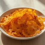 Cheese Whisps DIY: Crispy golden cheese whisps DIY recipe on a baking sheet with a crunchy texture and lacy edges, perfect keto snack.