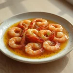 Pickled Shrimp Appetizer: Jar of tangy pickled shrimp appetizer with brine, herbs, and citrus zest