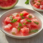 Watermelon Mint Detox: Vibrant pink watermelon cubes and green mint leaves in a clear pitcher of detox water, perfect for Weight Loss Drinks & Detox Waters.