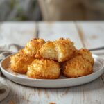 Sugar Free Coconut Macaroons: Golden sugar free coconut macaroons with crisp edges and toasted tops on a white plate, keto-friendly snack