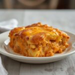 Buffalo Cauliflower Casserole: Golden baked Buffalo Cauliflower Casserole with melted cheese and creamy spicy sauce in a dish