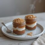 Cocoa Coconut Hemp Jars: Jars with cocoa coconut hemp layers, glistening with a toasted seed topping for keto snacking.
