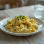 Creamy Egg Salad: Creamy egg salad in a white bowl with chives, perfect for a keto breakfast.