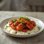 Gochujang Chicken Rice Bowl: Gochujang Chicken Rice Bowl with crispy glazed chicken and rice, topped with green onions