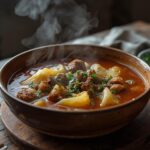 Keto Cabbage Roll Soup: A bowl of glistening Keto Cabbage Roll Soup with ground beef and tender cabbage in a rich broth.
