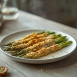 Keto Parmesan Asparagus Fries: Crispy keto Parmesan asparagus fries in an air fryer basket with golden, toasted coating.
