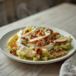 Keto Waldorf Salad: Keto Waldorf Salad with creamy dressing, crisp apples, and toasted walnuts on a marble board.