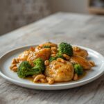 Low Carb Cashew Chicken: Low Carb Cashew Chicken stir fry with golden chicken and toasted cashews in a skillet.