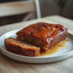 Low Carb Meatloaf: Low Carb Meatloaf with a glistening glaze in a pan, golden top and crisp edges.