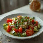 Persian Cucumber Tomato Salad: Fresh Persian Cucumber Tomato Salad in a white bowl with glistening dressing, showcasing crisp cucumbers and ruby-red tomatoes.