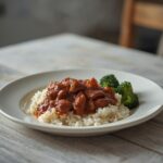 Spicy Beef Bulgogi Bowl: Spicy beef bulgogi bowl with caramelized beef, fluffy rice, and steamed broccoli on a white plate.