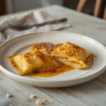 Wonton Wrapper Ravioli: Golden crispy keto wonton wrapper ravioli with creamy ricotta filling on a plate