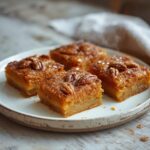 Keto Pumpkin Pecan Squares: Keto Pumpkin Pecan Squares on a plate with toasted pecans and caramel-brown top